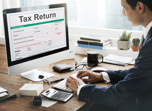 A guy calculating tax return