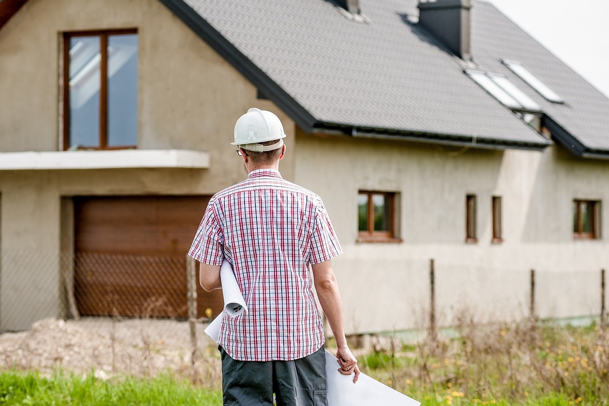 A contractor wearing a white safety hat