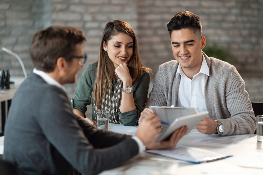 A couple talking to an insurance agent