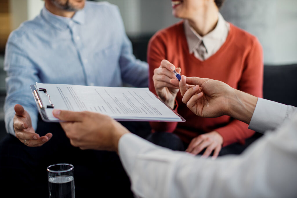 Business owners purchasing business insurance policies
