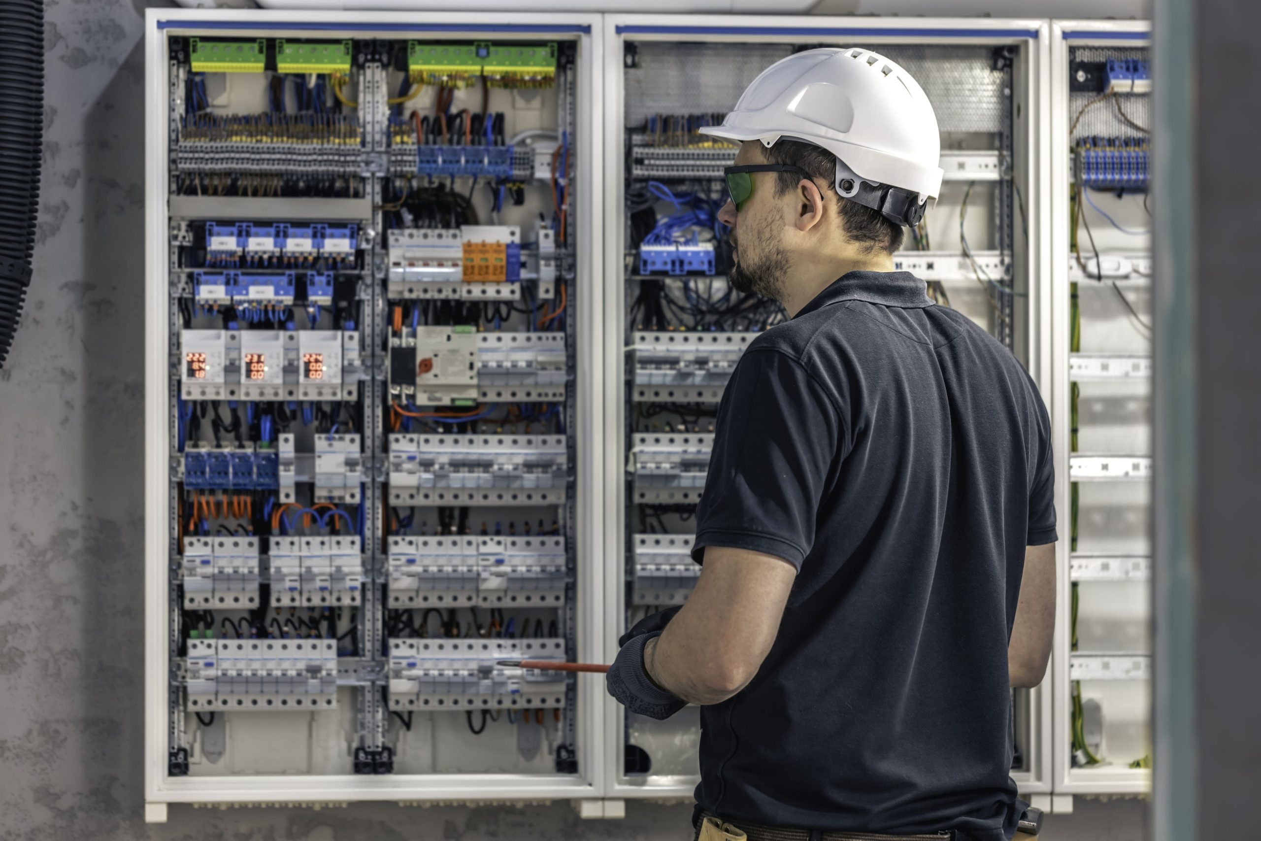 Electrician working on the switchboard