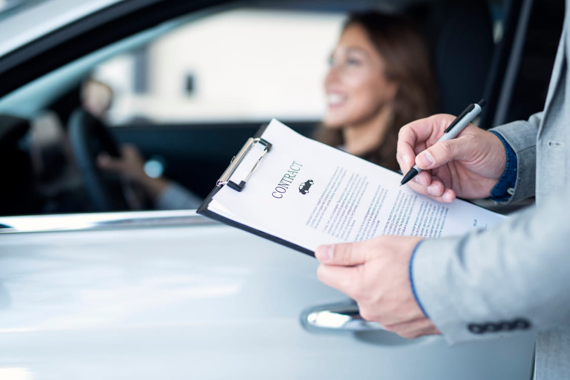 Woman in her car with the insurance provider